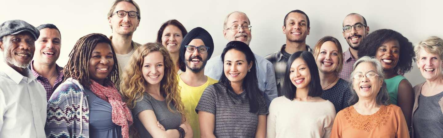 Mix of people all facing camera in a line